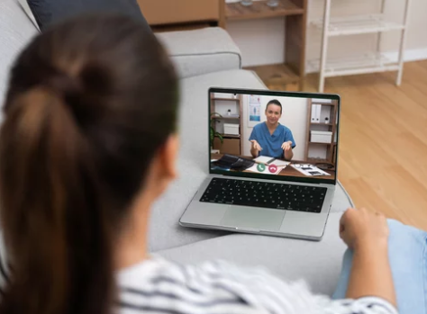 Person reviewing B12 injection needle options while consulting a clinician online about comfort and safety