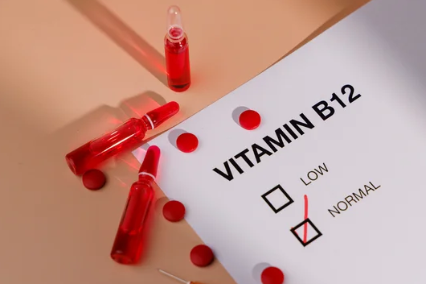 weight loss progress chart next to a vitamin B12 injection vial